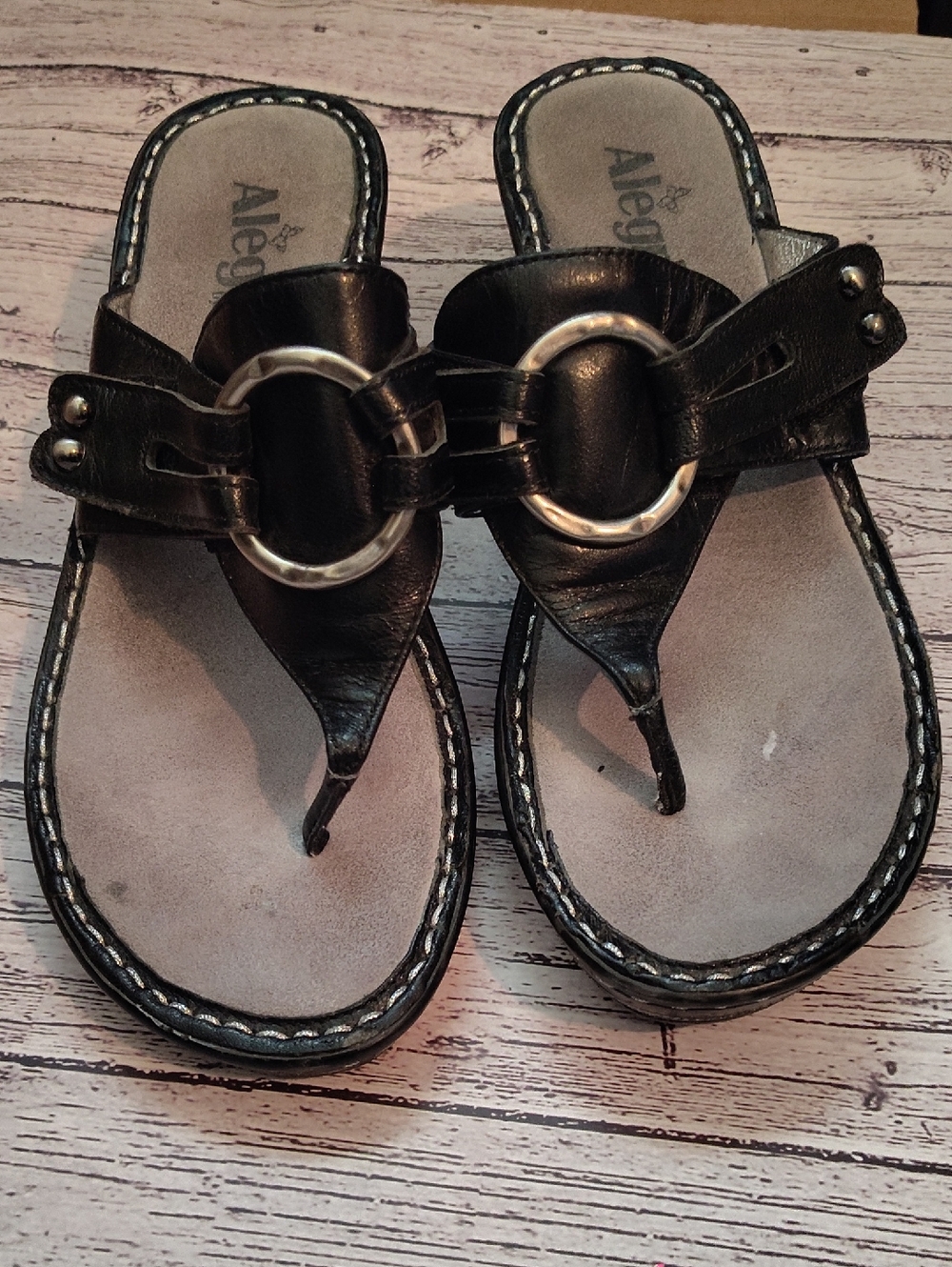 Alegria Black Leather Thong Sandals with Silver Ring Accent